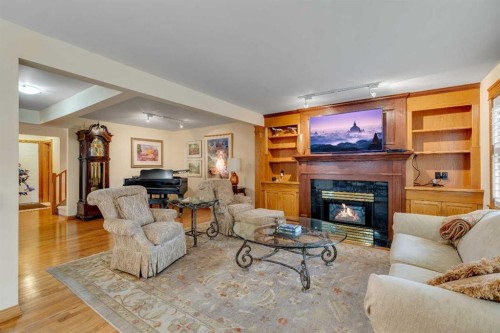204 Paliswood Park Sw, Calgary, AB - Indoor Photo Showing Living Room With Fireplace