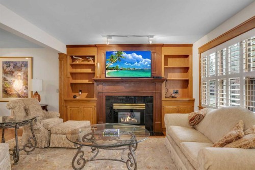 204 Paliswood Park Sw, Calgary, AB - Indoor Photo Showing Living Room With Fireplace