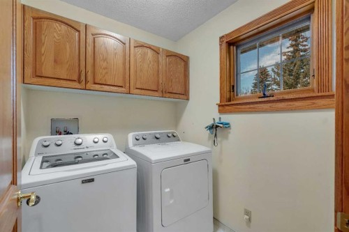 204 Paliswood Park Sw, Calgary, AB - Indoor Photo Showing Laundry Room