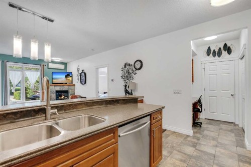 101-8 Hemlock Crescent Sw, Calgary, AB - Indoor Photo Showing Kitchen With Double Sink
