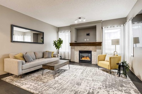 9 Cranwell Court Se, Calgary, AB - Indoor Photo Showing Living Room With Fireplace