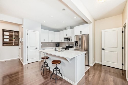 570 River Heights Crescent, Cochrane, AB - Indoor Photo Showing Kitchen With Stainless Steel Kitchen