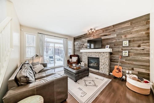 570 River Heights Crescent, Cochrane, AB - Indoor Photo Showing Living Room With Fireplace