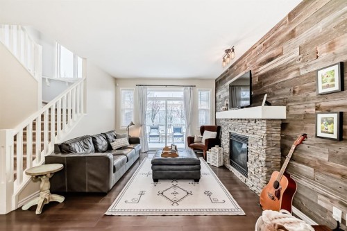 570 River Heights Crescent, Cochrane, AB - Indoor Photo Showing Living Room With Fireplace