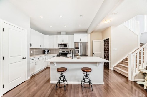 570 River Heights Crescent, Cochrane, AB - Indoor Photo Showing Kitchen With Upgraded Kitchen
