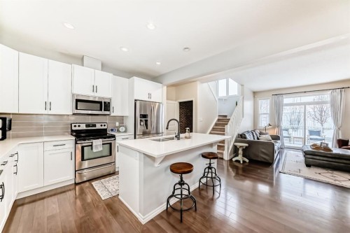 570 River Heights Crescent, Cochrane, AB - Indoor Photo Showing Kitchen With Stainless Steel Kitchen With Upgraded Kitchen
