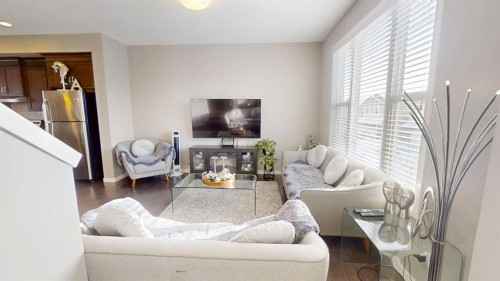 165 Panatella Square Nw, Calgary, AB - Indoor Photo Showing Living Room