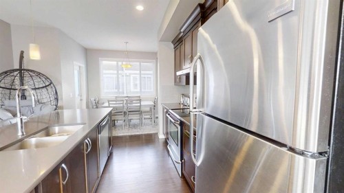 165 Panatella Square Nw, Calgary, AB - Indoor Photo Showing Kitchen With Double Sink With Upgraded Kitchen