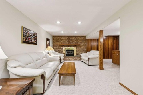 34 Atlanta Crescent Se, Calgary, AB - Indoor Photo Showing Living Room With Fireplace