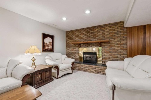 34 Atlanta Crescent Se, Calgary, AB - Indoor Photo Showing Living Room With Fireplace