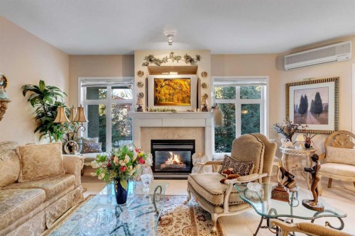3206-3206 Lake Fraser Court Se, Calgary, AB - Indoor Photo Showing Living Room With Fireplace