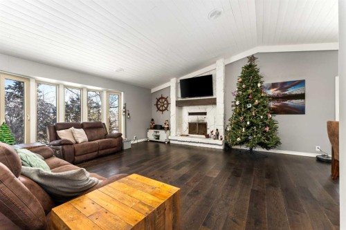 434205 32 Street East, Rural Foothills County, AB - Indoor Photo Showing Living Room With Fireplace