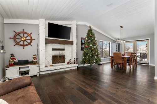 434205 32 Street East, Rural Foothills County, AB - Indoor Photo Showing Living Room With Fireplace