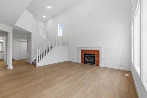 213 Tuscany  Ravine Close Nw, Calgary, AB - Indoor With Fireplace