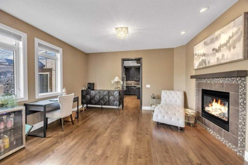 172 Panatella Crescent Nw, Calgary, AB - Indoor Photo Showing Living Room With Fireplace