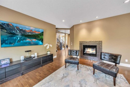 172 Panatella Crescent Nw, Calgary, AB - Indoor Photo Showing Living Room With Fireplace