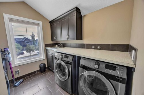 172 Panatella Crescent Nw, Calgary, AB - Indoor Photo Showing Laundry Room