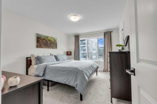315 Wolf Creek Way Se, Calgary, AB - Indoor Photo Showing Bedroom