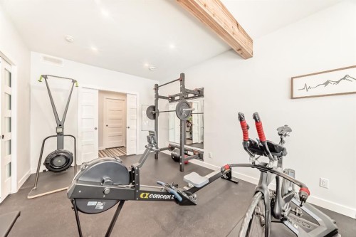 280 Precedence View, Cochrane, AB - Indoor Photo Showing Gym Room