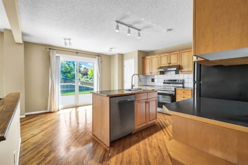 11137 Hidden Valley Drive Nw, Calgary, AB - Indoor Photo Showing Kitchen With Double Sink