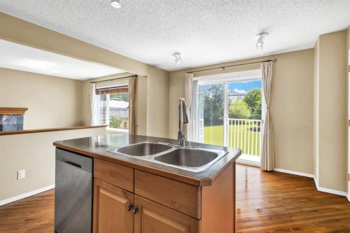11137 Hidden Valley Drive Nw, Calgary, AB - Indoor Photo Showing Kitchen With Double Sink
