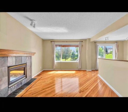 11137 Hidden Valley Drive Nw, Calgary, AB - Indoor Photo Showing Living Room With Fireplace