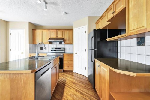 11137 Hidden Valley Drive Nw, Calgary, AB - Indoor Photo Showing Kitchen With Double Sink
