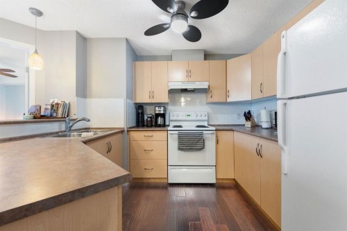 2218-505 Railway Street West, Cochrane, AB - Indoor Photo Showing Kitchen With Double Sink