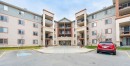 2218-505 Railway Street West, Cochrane, AB  - Outdoor With Facade 