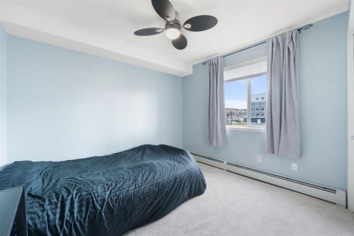 2218-505 Railway Street West, Cochrane, AB - Indoor Photo Showing Bedroom