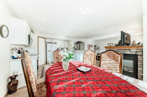 51 Everstone Boulevard Sw, Calgary, AB - Indoor Photo Showing Dining Room With Fireplace