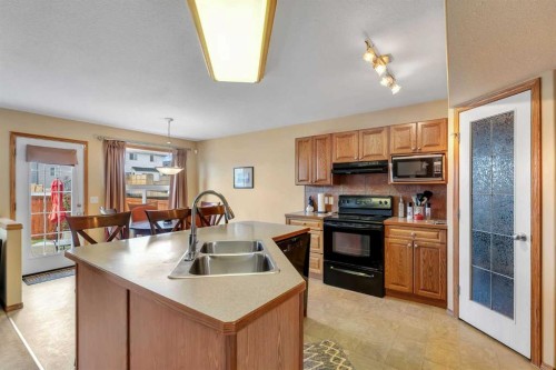 214 Saddlemont Boulevard Ne, Calgary, AB - Indoor Photo Showing Kitchen With Double Sink