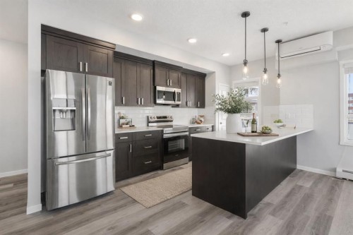 302-200 Harvest Hills Place Ne, Calgary, AB - Indoor Photo Showing Kitchen With Stainless Steel Kitchen With Upgraded Kitchen
