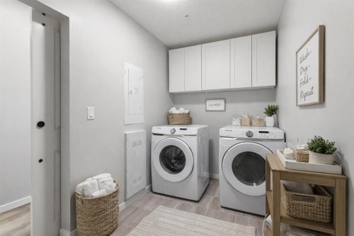 302-200 Harvest Hills Place Ne, Calgary, AB - Indoor Photo Showing Laundry Room