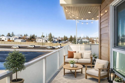 302-200 Harvest Hills Place Ne, Calgary, AB - Outdoor With Balcony With Exterior