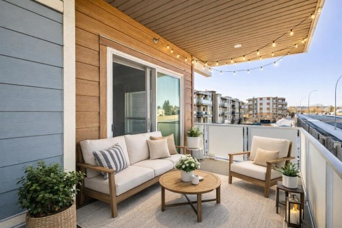 302-200 Harvest Hills Place Ne, Calgary, AB - Outdoor With Deck Patio Veranda With Exterior