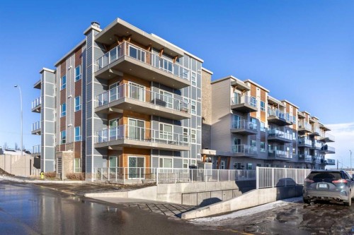 302-200 Harvest Hills Place Ne, Calgary, AB - Outdoor With Balcony With Facade