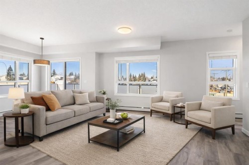 302-200 Harvest Hills Place Ne, Calgary, AB - Indoor Photo Showing Living Room