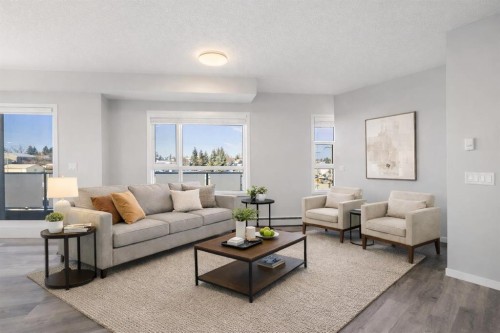 302-200 Harvest Hills Place Ne, Calgary, AB - Indoor Photo Showing Living Room