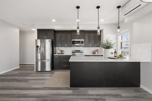 302-200 Harvest Hills Place Ne, Calgary, AB - Indoor Photo Showing Kitchen With Stainless Steel Kitchen With Upgraded Kitchen