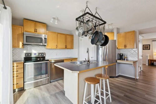 31 Prestwick Grove Se, Calgary, AB - Indoor Photo Showing Kitchen With Stainless Steel Kitchen With Double Sink