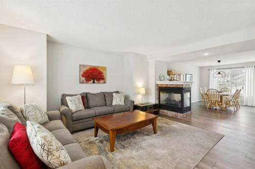 31 Prestwick Grove Se, Calgary, AB - Indoor Photo Showing Living Room With Fireplace
