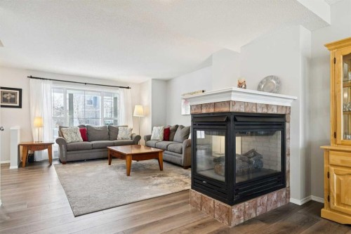 31 Prestwick Grove Se, Calgary, AB - Indoor Photo Showing Living Room With Fireplace