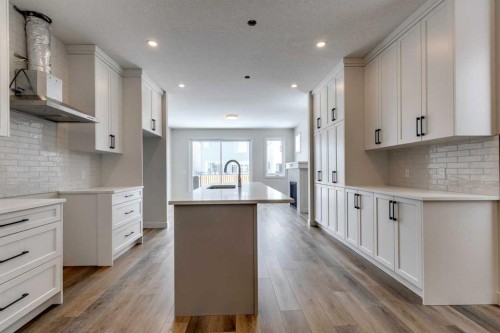 554 Rivercrest View, Cochrane, AB - Indoor Photo Showing Kitchen With Upgraded Kitchen