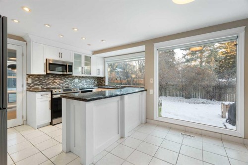 1447 Acadia Drive Se, Calgary, AB - Indoor Photo Showing Kitchen With Upgraded Kitchen