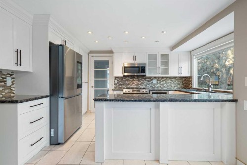 1447 Acadia Drive Se, Calgary, AB - Indoor Photo Showing Kitchen With Upgraded Kitchen