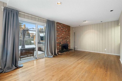 1447 Acadia Drive Se, Calgary, AB - Indoor With Fireplace