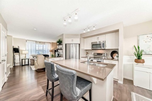 112 Sunvalley Road, Cochrane, AB - Indoor Photo Showing Kitchen With Stainless Steel Kitchen With Double Sink With Upgraded Kitchen