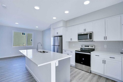 239 Savoy Landing Se, Calgary, AB - Indoor Photo Showing Kitchen With Stainless Steel Kitchen With Double Sink With Upgraded Kitchen