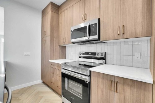 144 Cobblestone Gate Sw, Airdrie, AB - Indoor Photo Showing Kitchen